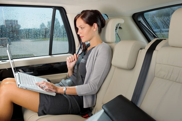 Business woman in taxi